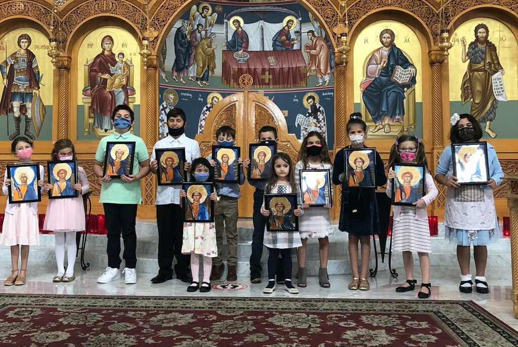 children holding icons at Saint George Greek Orthodox Church Downey during Day of Orthodoxy